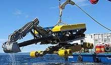 Подводный экскаватор  Menzi Muck подготавливает океанское дно к прокладке газопровода